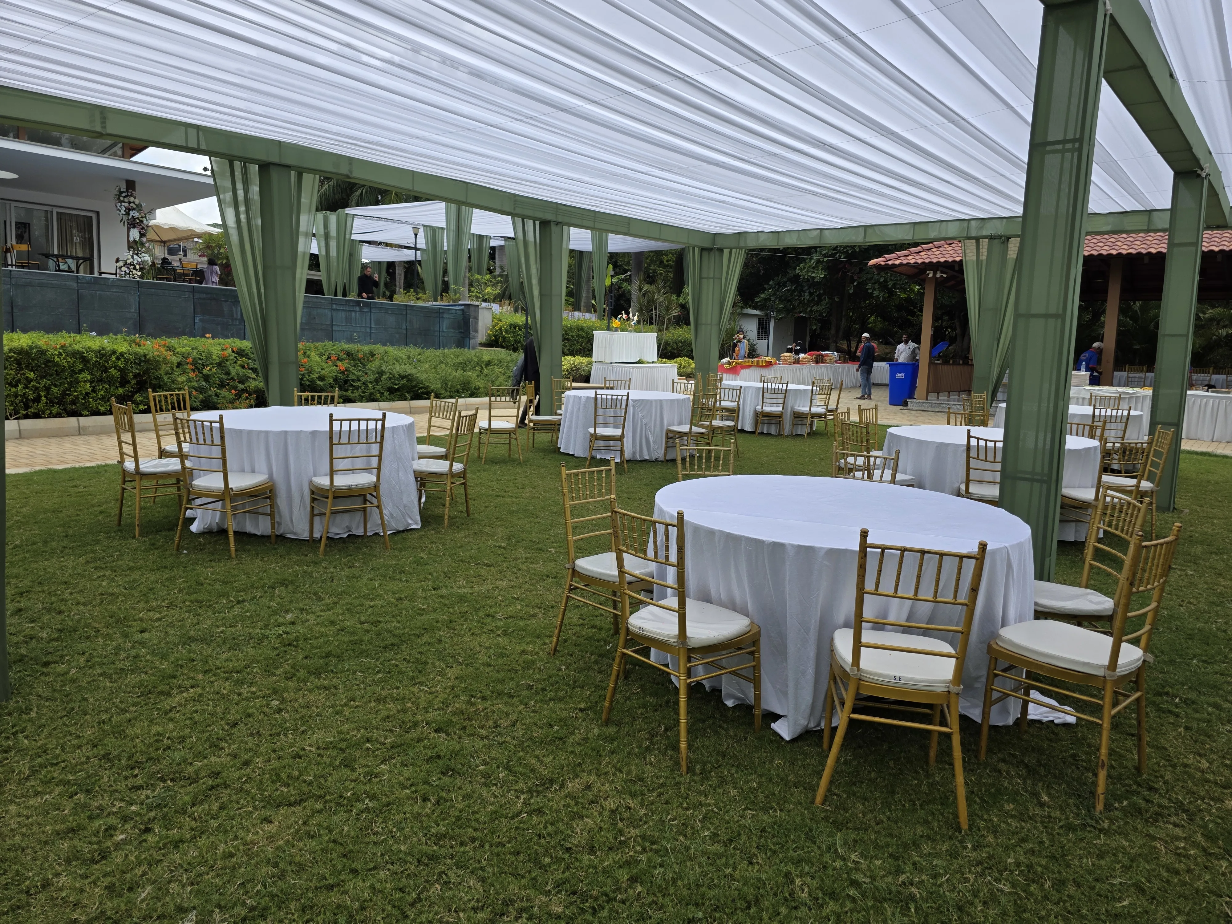 Outdoor haldi ceremony mandap with yellow marigold garlands