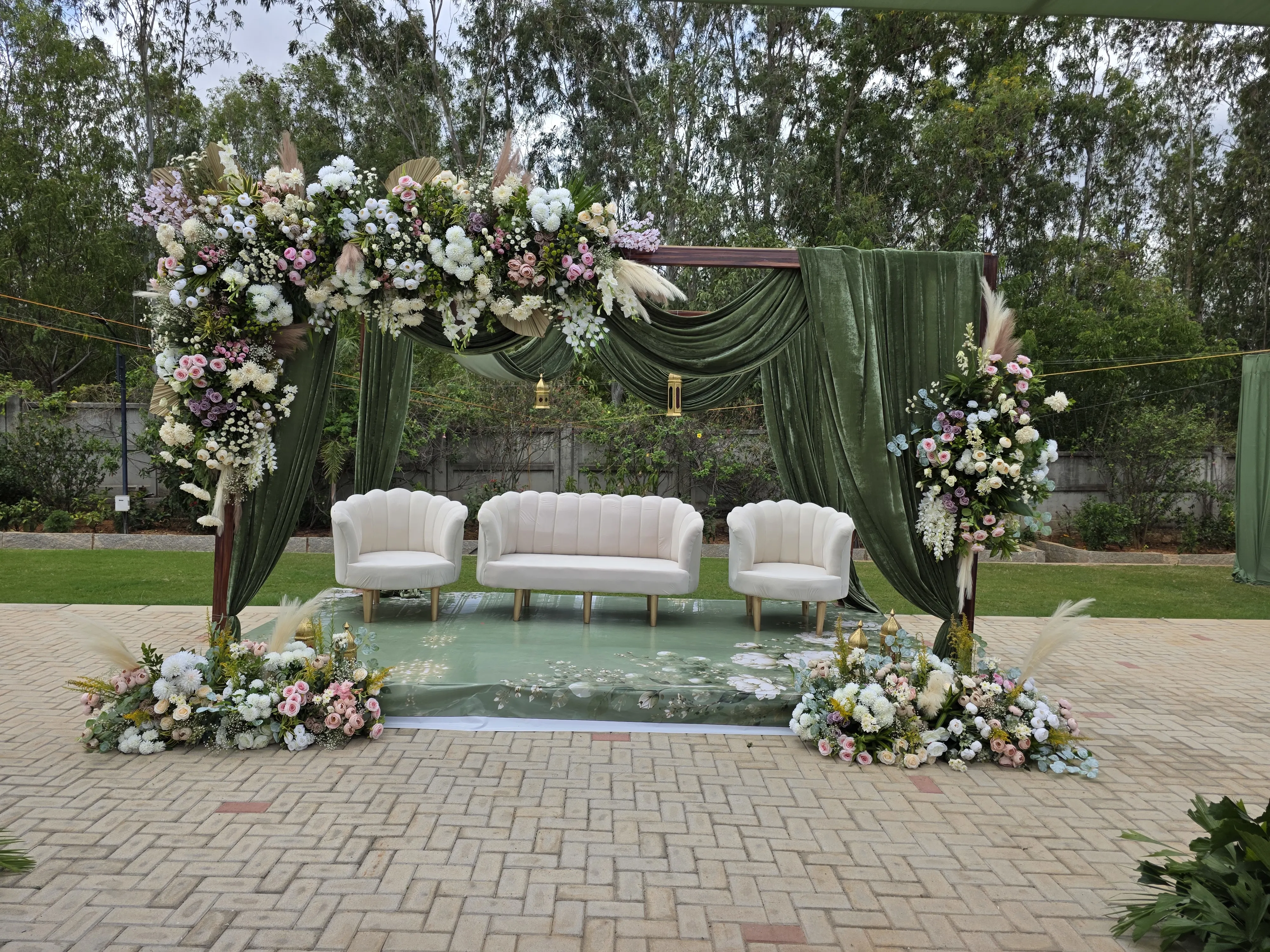 Intimate engagement stage with blush roses and candlelit ring table