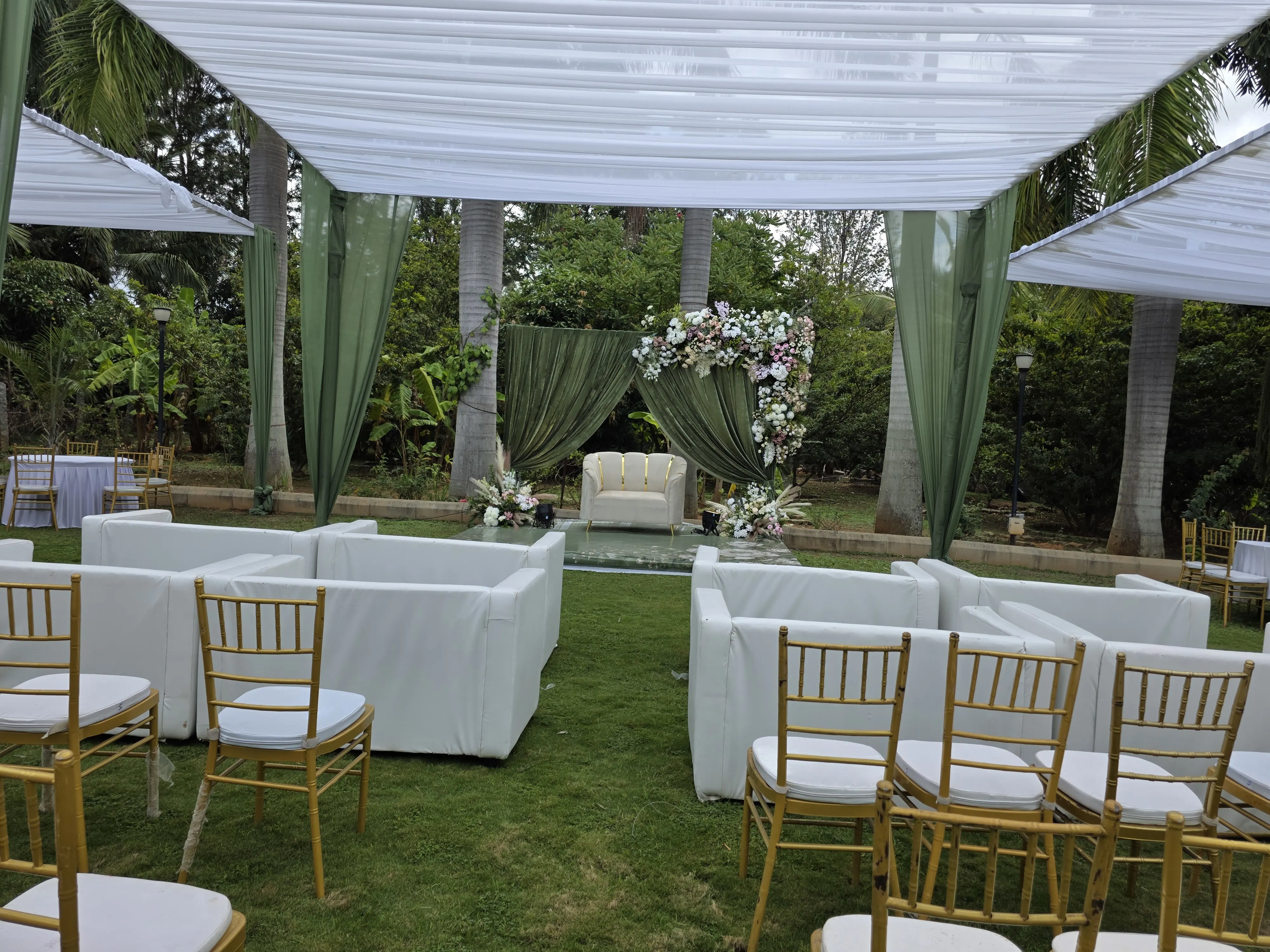 Champagne and ivory balloon birthday backdrop with floral cake table