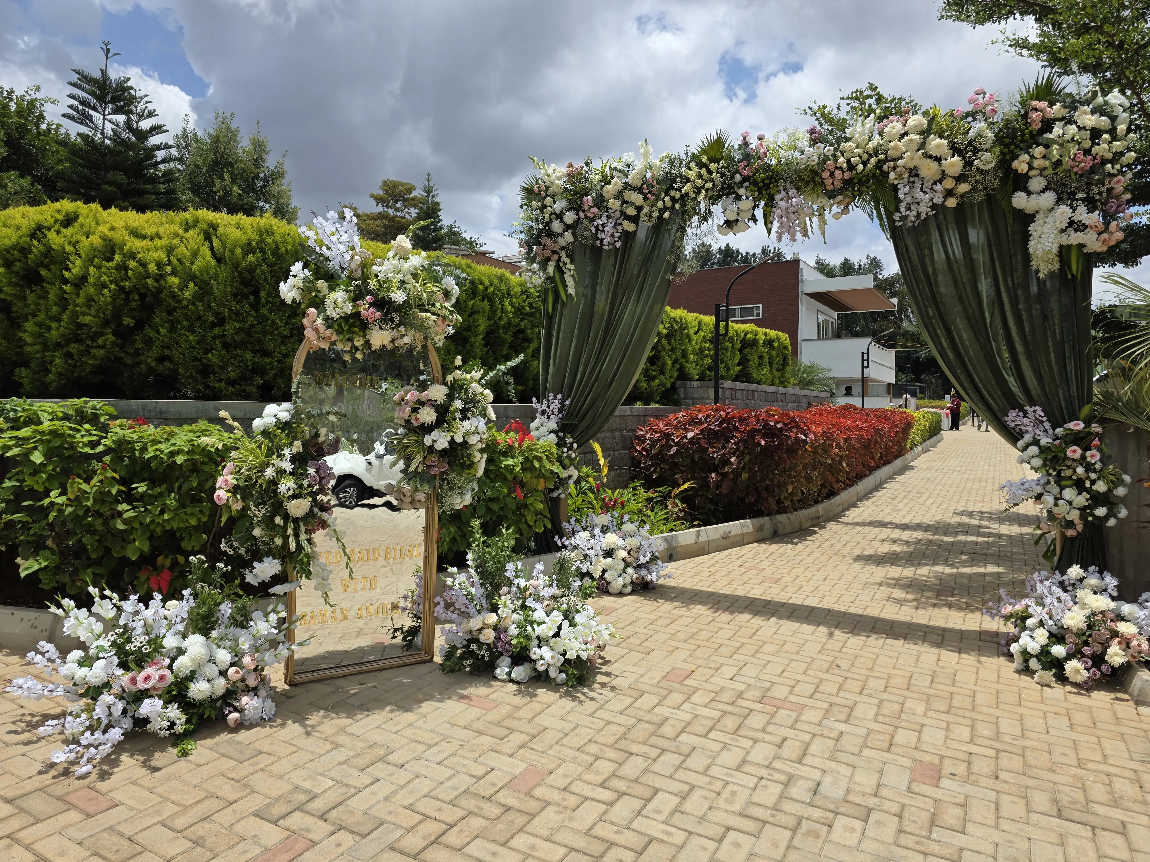 Mehendi ceremony courtyard with marigold florals and floor seating